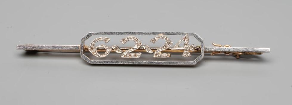A DIAMOND "DATE" BAR BROOCH, the open canted panel centred by the date 6.2.24, the numerals all pave Image