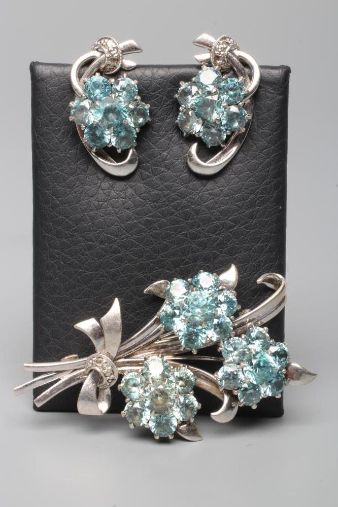 A BLUE TOPAZ TRIPLE FLOWER SPRAY BROOCH Image