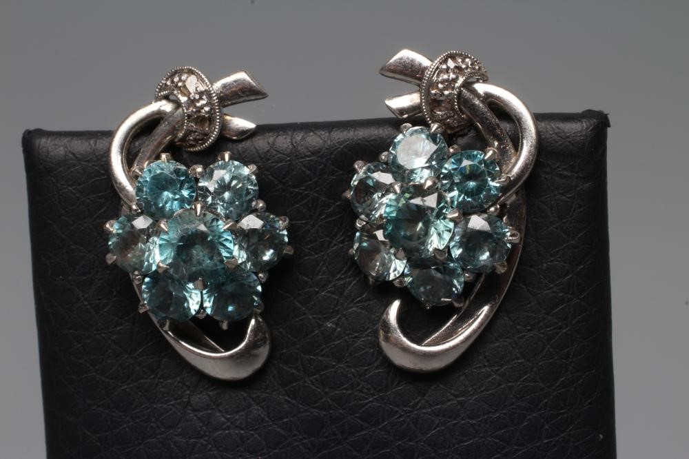 A BLUE TOPAZ TRIPLE FLOWER SPRAY BROOCH Image