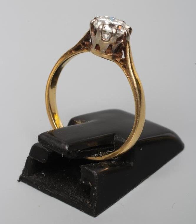 A SOLITAIRE DIAMOND RING, the brilliant cut stone of approximately 0.60cts, claw set to a plain Image
