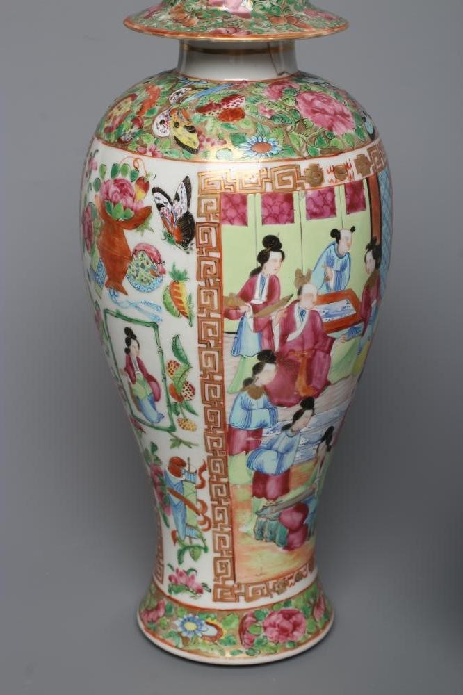 THREE CANTONESE PORCELAIN FAMILLE ROSE VASES AND COVERS of inverted baluster form, all painted with Image