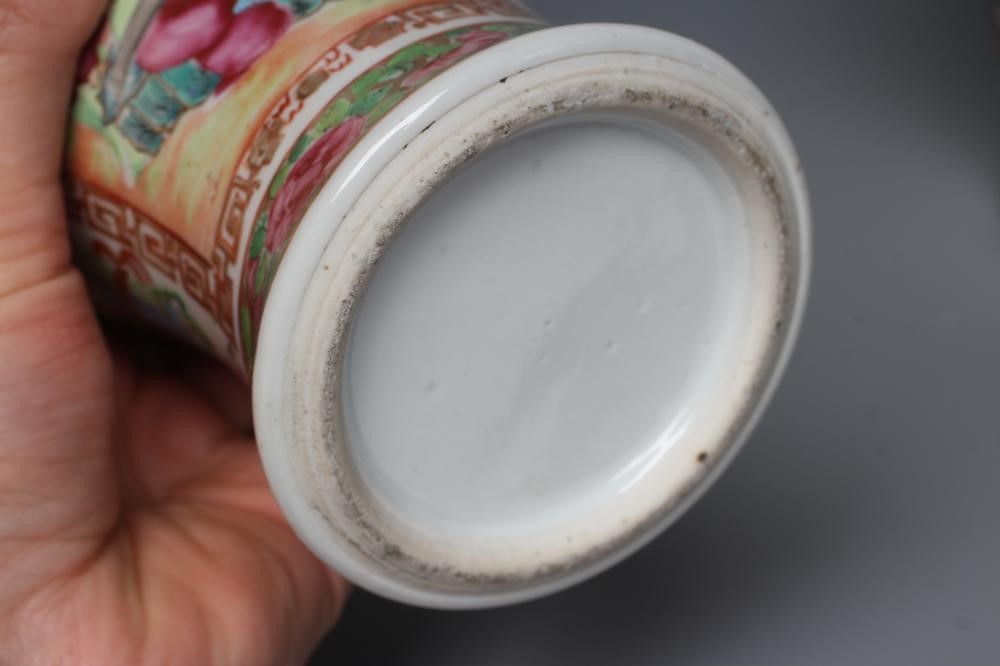 THREE CANTONESE PORCELAIN FAMILLE ROSE VASES AND COVERS of inverted baluster form, all painted with Image