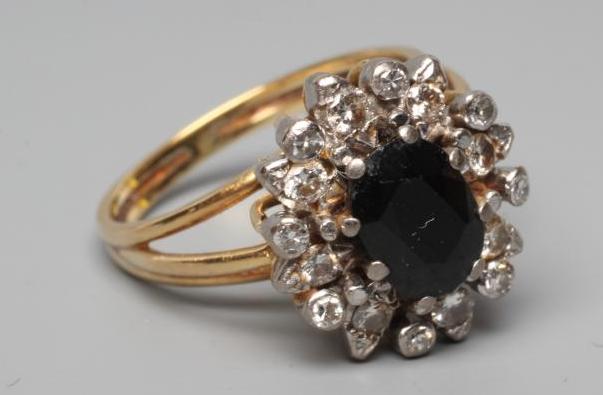 A SAPPHIRE AND DIAMOND CLUSTER RING Image