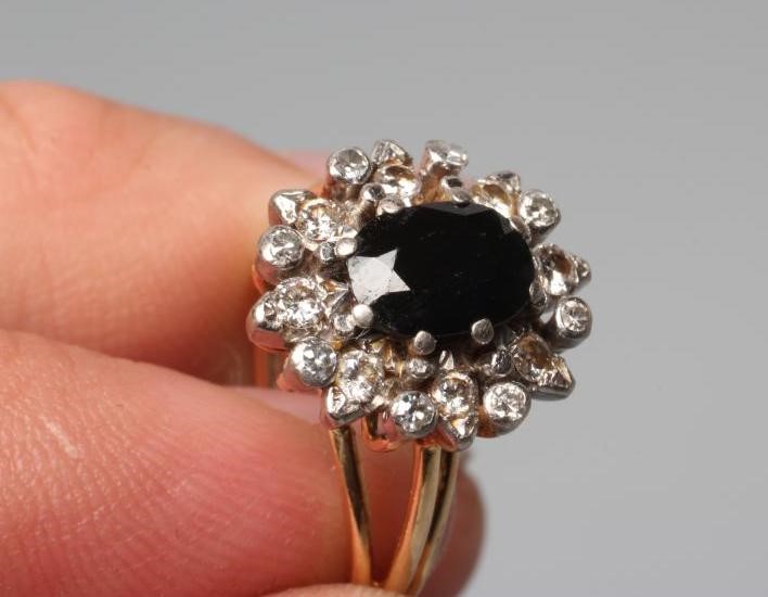 A SAPPHIRE AND DIAMOND CLUSTER RING Image