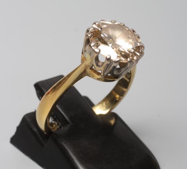 A SOLITAIRE DIAMOND RING, the round brilliant cut stone of approximately 2.35cts, claw set to a Image
