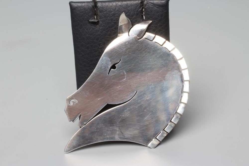 A GEORG JENSEN SILVER HORSE HEAD BROOCH designed by Arno Malinowski, stamped and numbered 90 Image