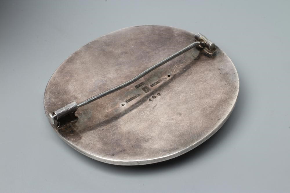 A GEORG JENSEN SILVER CIRCULAR BOSS BROOCH designed by Hugo Lisberg, chased with a stork, stamped Image