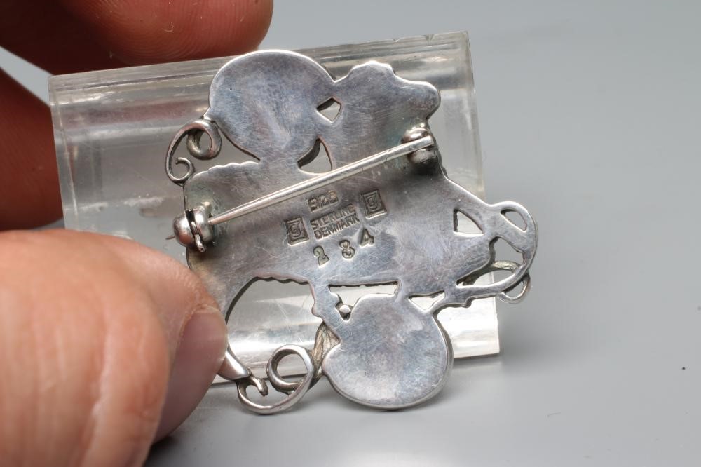 A GEORG JENSEN SILVER BROOCH designed by Arno Malinowski Image