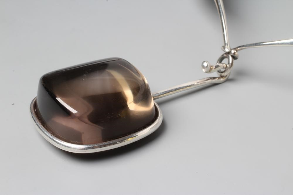 A GEORG JENSEN SILVER NECK RING designed by Vivianna Torun Bulow-Hube Image