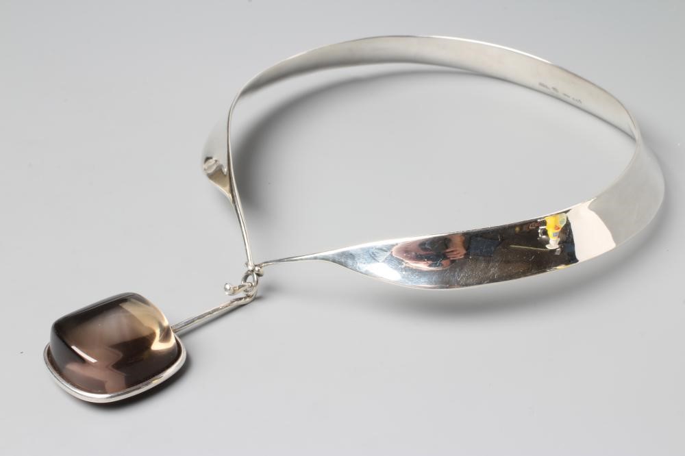 A GEORG JENSEN SILVER NECK RING designed by Vivianna Torun Bulow-Hube Image