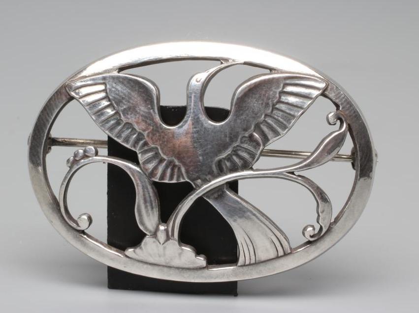 A GEORG JENSEN SILVER OVAL BROOCH designed by Arno Malinowski, cast as a crane in flight, stamped Image