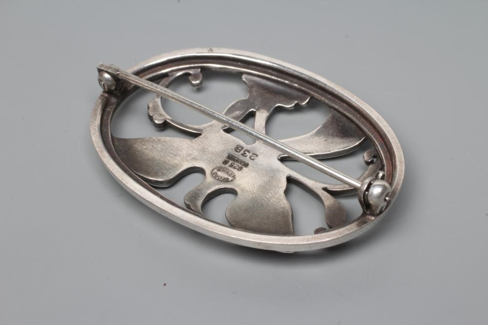 A GEORG JENSEN SILVER OVAL BROOCH designed by Arno Malinowski, cast as a crane in flight, stamped Image