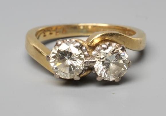 A TWO STONE CROSSOVER DIAMOND RING Image