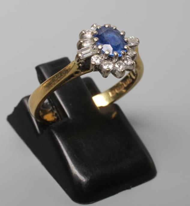 A SAPPHIRE AND DIAMOND CLUSTER RING Image