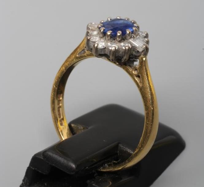 A SAPPHIRE AND DIAMOND CLUSTER RING Image