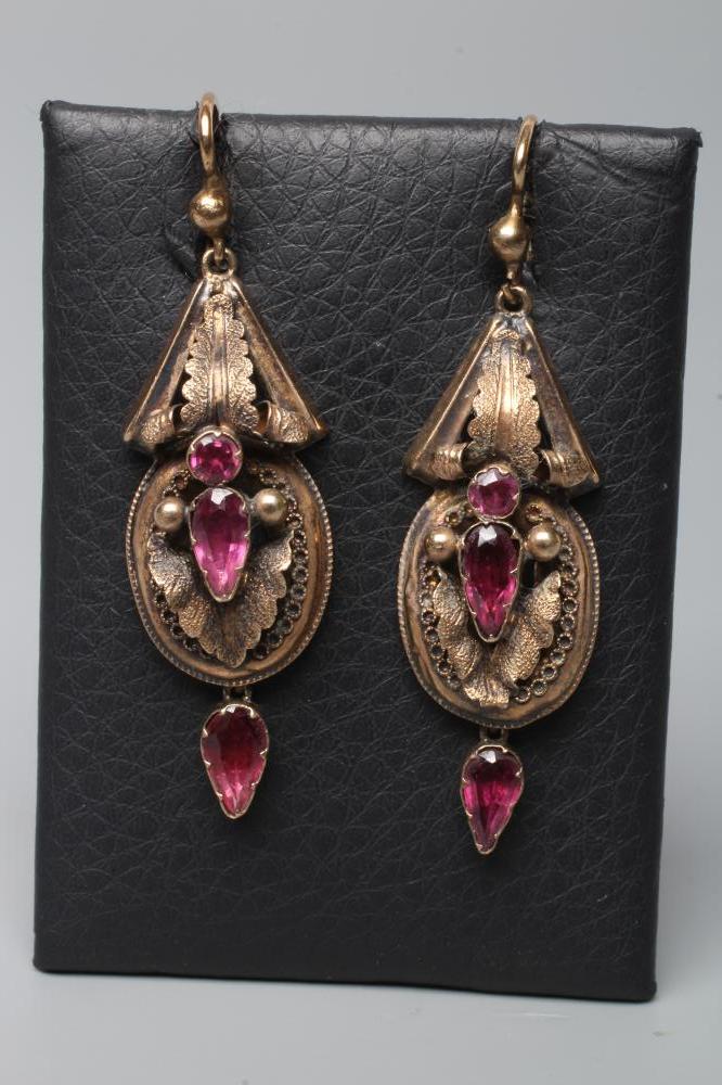 A PAIR OF VICTORIAN EAR BOBS, the open leafy panels centred by mixed cut almandine garnets and hung Image