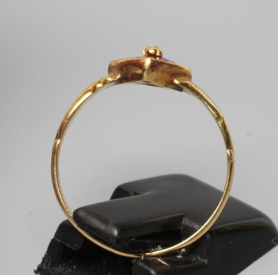 A VICTORIAN ALMANDINE GARNET RING, the lozenge panel set with four stones centred by a bead, to Image