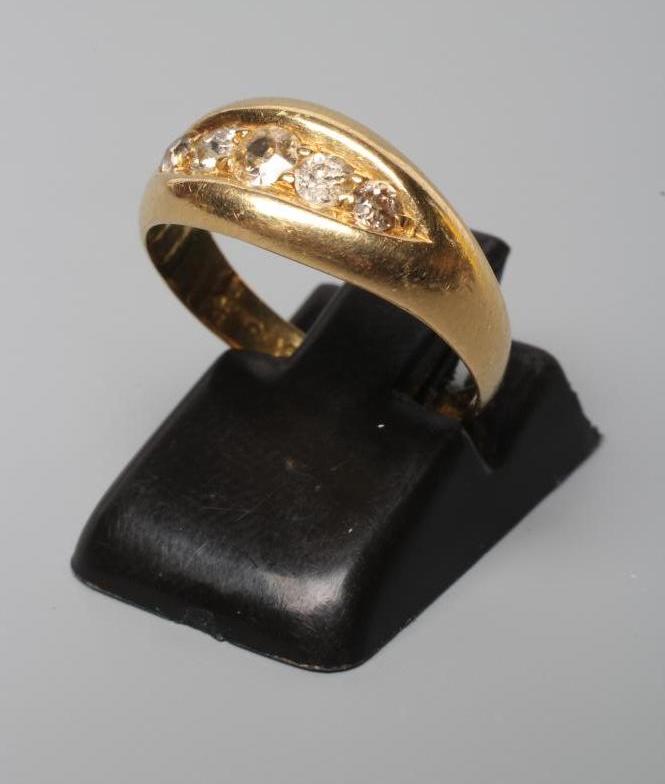 A LATE VICTORIAN DIAMOND RING, set with five mix cut stones in a boat panel to a plain 18ct gold Image