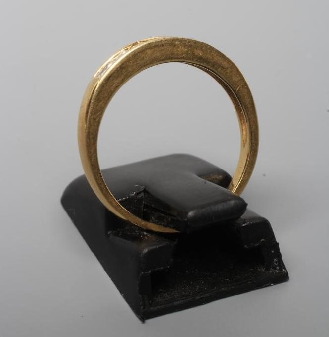 A SEVEN STONE DIAMOND HALF HOOP RING, the three round brilliants flanked by two pairs of square cut Image