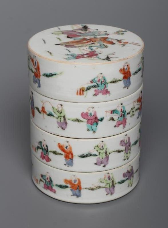 A CHINESE PORCELAIN CYLINDRICAL THREE TIER STACKING BOX AND COVER painted in pastel enamels with Image