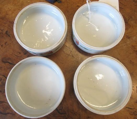 A CHINESE PORCELAIN CYLINDRICAL THREE TIER STACKING BOX AND COVER painted in pastel enamels with Image