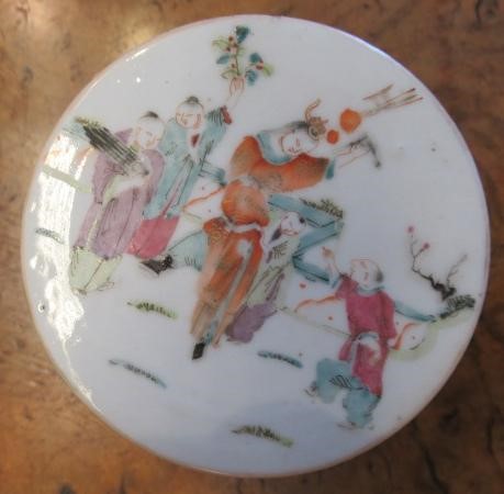 A CHINESE PORCELAIN CYLINDRICAL THREE TIER STACKING BOX AND COVER painted in pastel enamels with Image