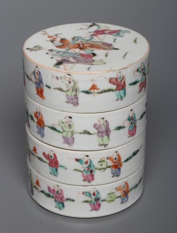 A CHINESE PORCELAIN CYLINDRICAL THREE TIER STACKING BOX AND COVER painted in pastel enamels with Image