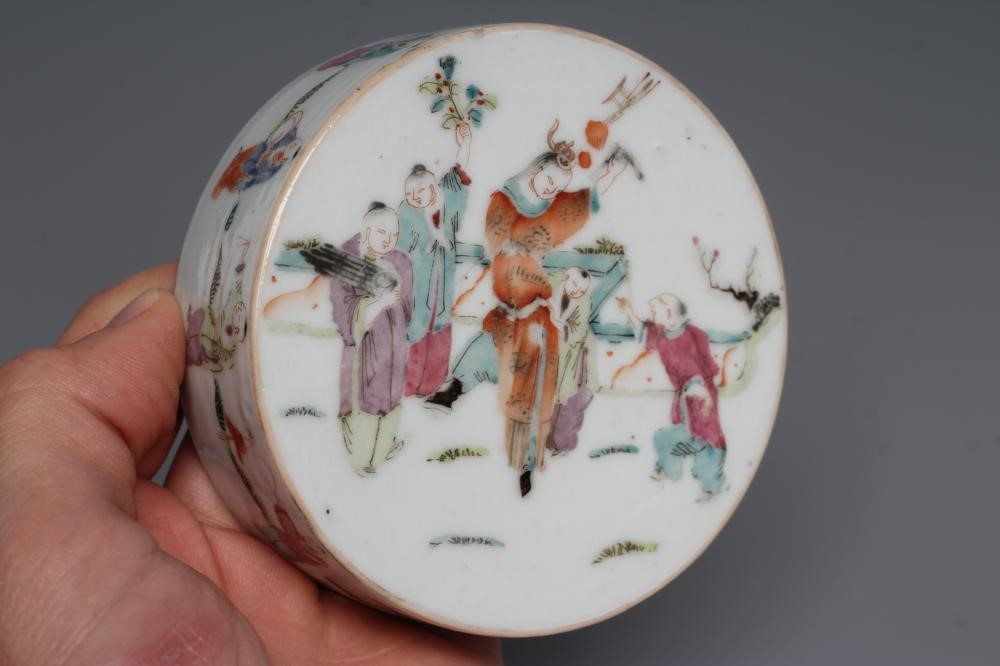 A CHINESE PORCELAIN CYLINDRICAL THREE TIER STACKING BOX AND COVER painted in pastel enamels with Image