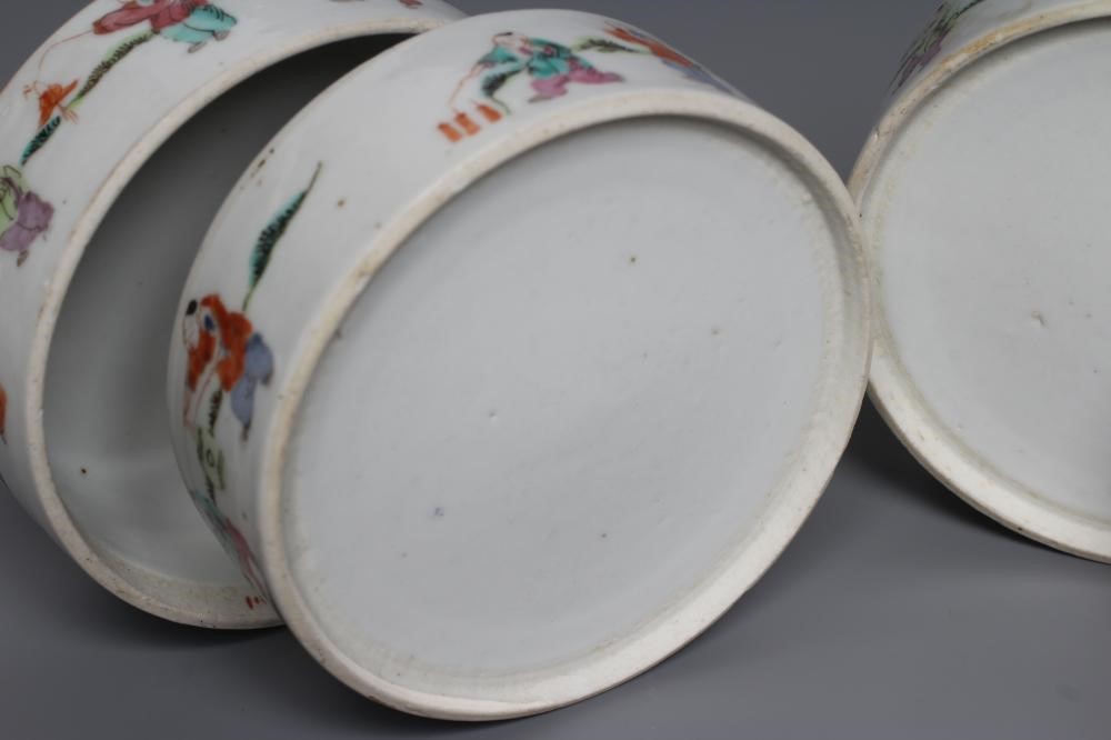 A CHINESE PORCELAIN CYLINDRICAL THREE TIER STACKING BOX AND COVER painted in pastel enamels with Image