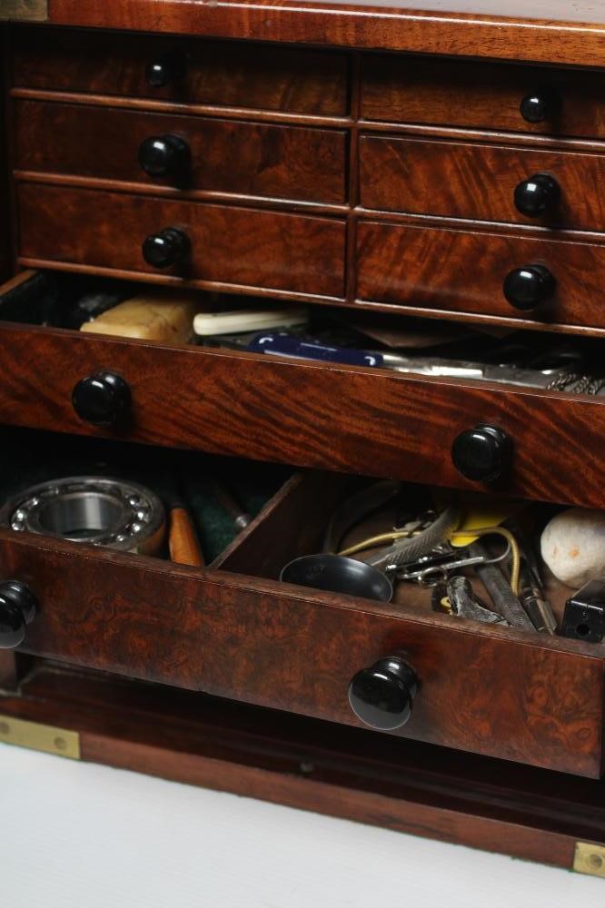 A VICTORIAN WALNUT SPECIMEN TABLE CABINET of oblong form with brass campaign carrying handle and Image