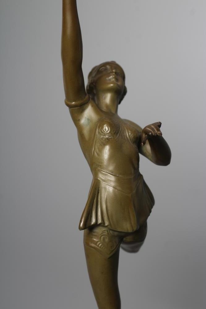 AN ART DECO green patinated spelter figure in the style of Lorenzl Image