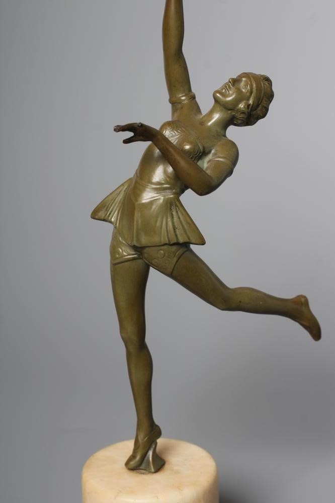 AN ART DECO green patinated spelter figure in the style of Lorenzl Image