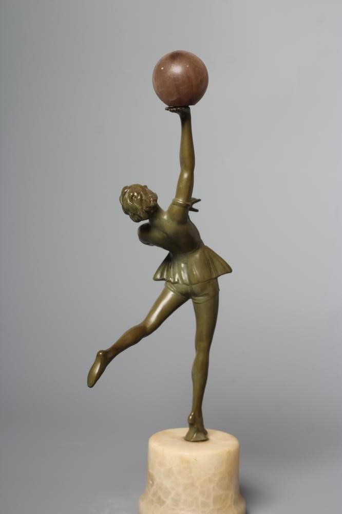 AN ART DECO green patinated spelter figure in the style of Lorenzl Image