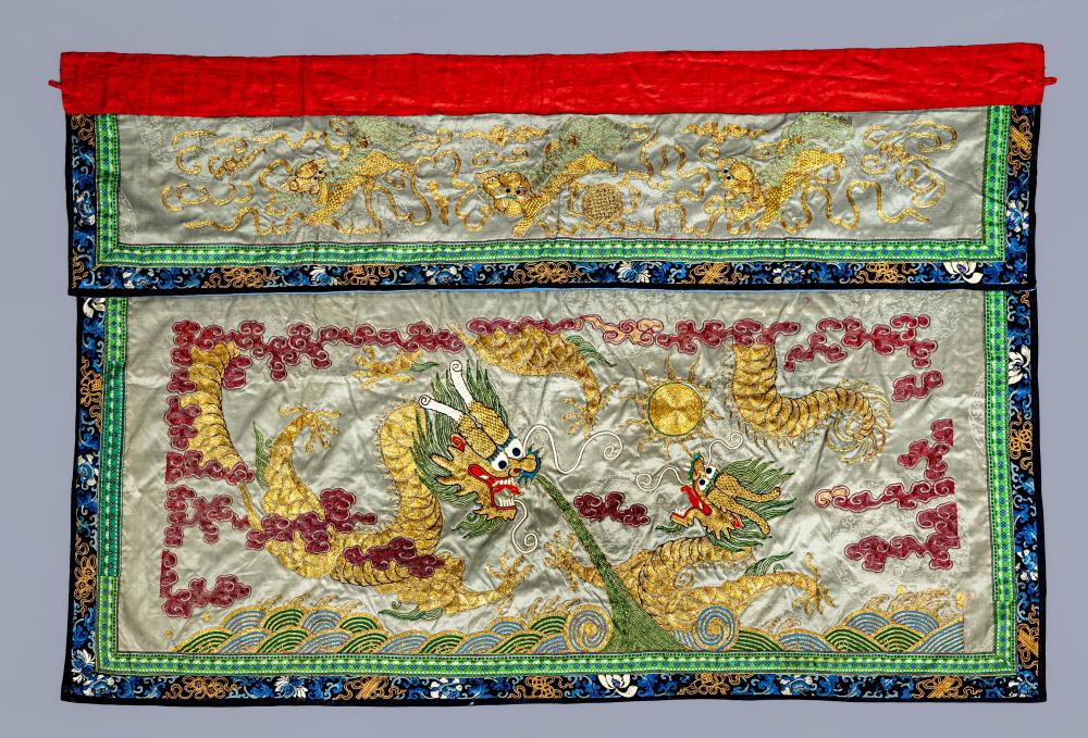 A CHINESE WALL HANGING embroidered in coloured silks on a grey damask ground with two dragons Image