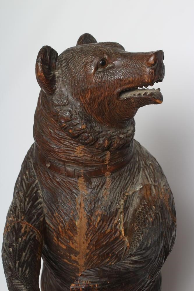 A CARVED WOOD BLACK FOREST BEAR STICK STAND Image