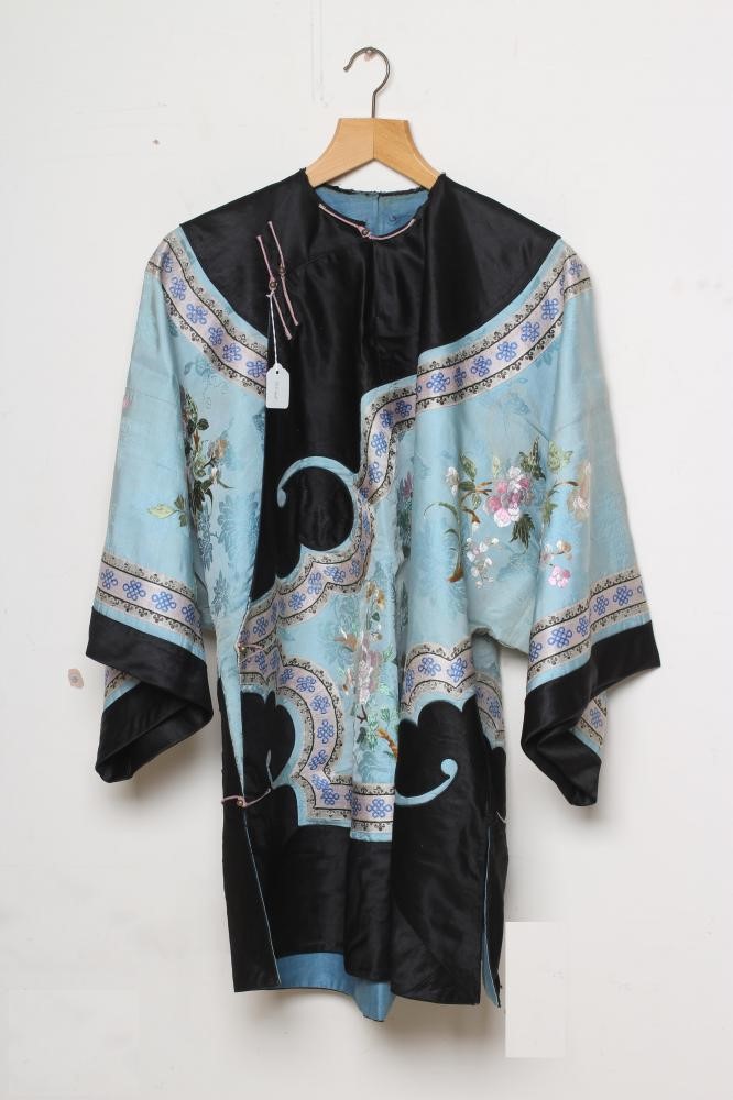 A CHINESE SILK ROBE embroidered in coloured silks with flowers Image