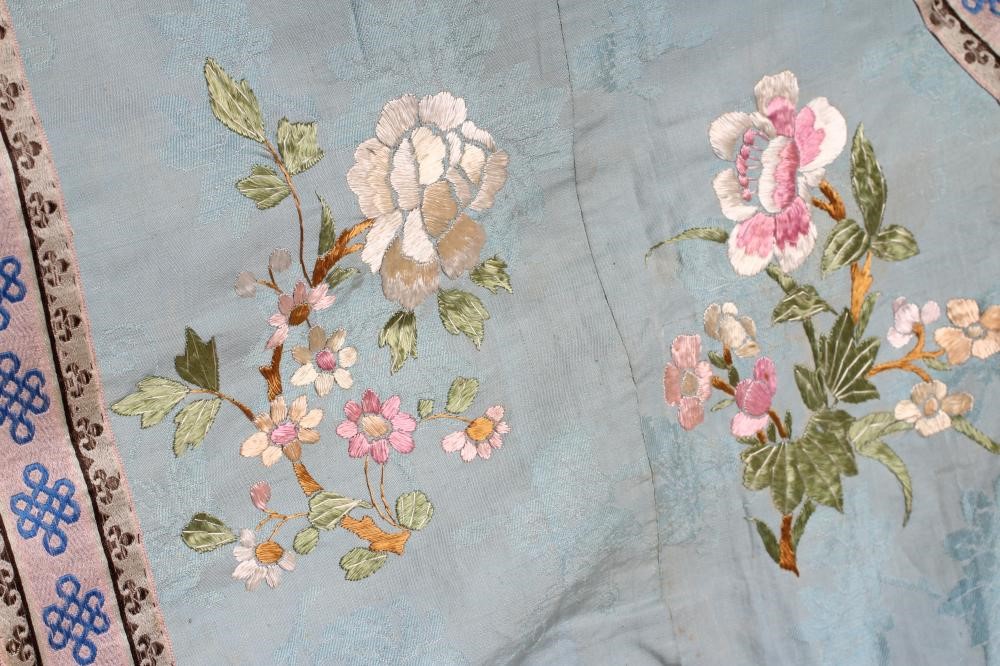 A CHINESE SILK ROBE embroidered in coloured silks with flowers Image
