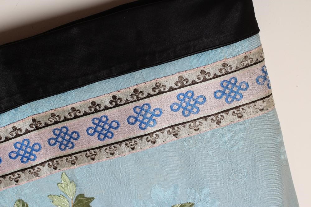 A CHINESE SILK ROBE embroidered in coloured silks with flowers Image