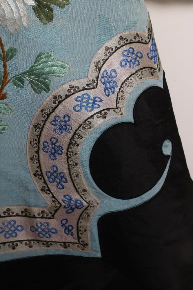 A CHINESE SILK ROBE embroidered in coloured silks with flowers Image