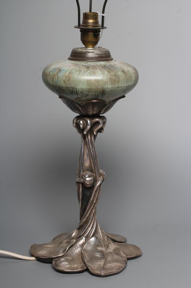 AN ART NOUVEAU SILVERED SPELTER OIL LAMP Image