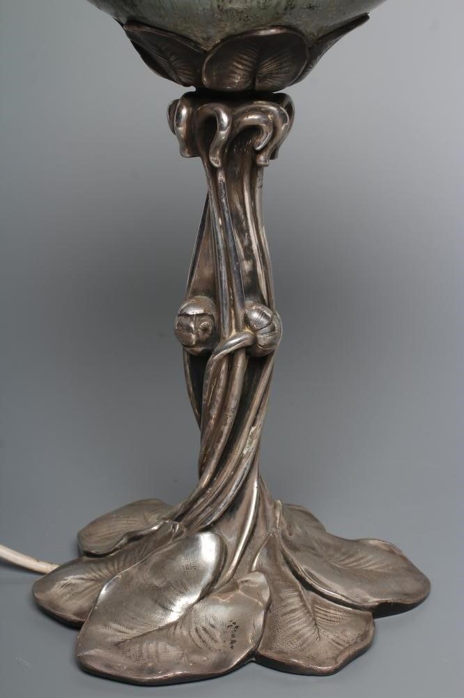 AN ART NOUVEAU SILVERED SPELTER OIL LAMP Image