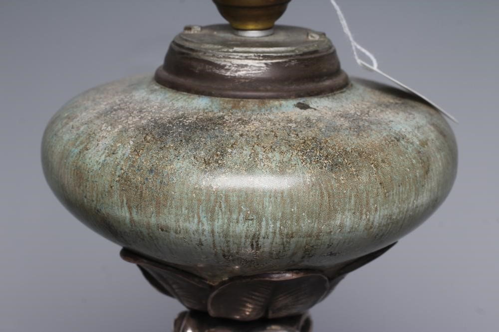 AN ART NOUVEAU SILVERED SPELTER OIL LAMP Image