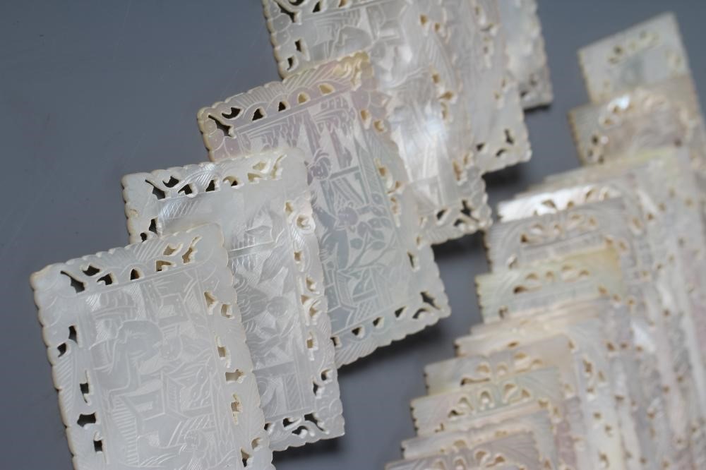 A COLLECTION OF FORTY CHINESE MOTHER OF PEARL GAMING TOKENS, all incise carved with figures, thirty Image