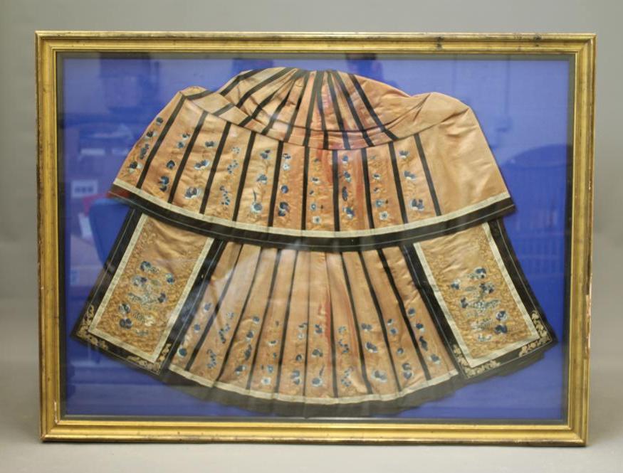 A CHINESE PLEATED SKIRT with black silk satin gores, and blue embroidered foliate panels, with Image