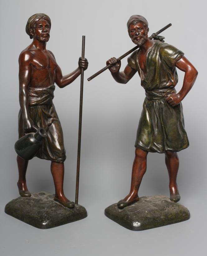 A PAIR OF PAINTED SPELTER ARAB MALE WATER CARRIERS, after Marcel Debut (1865-1933) each modelled Image