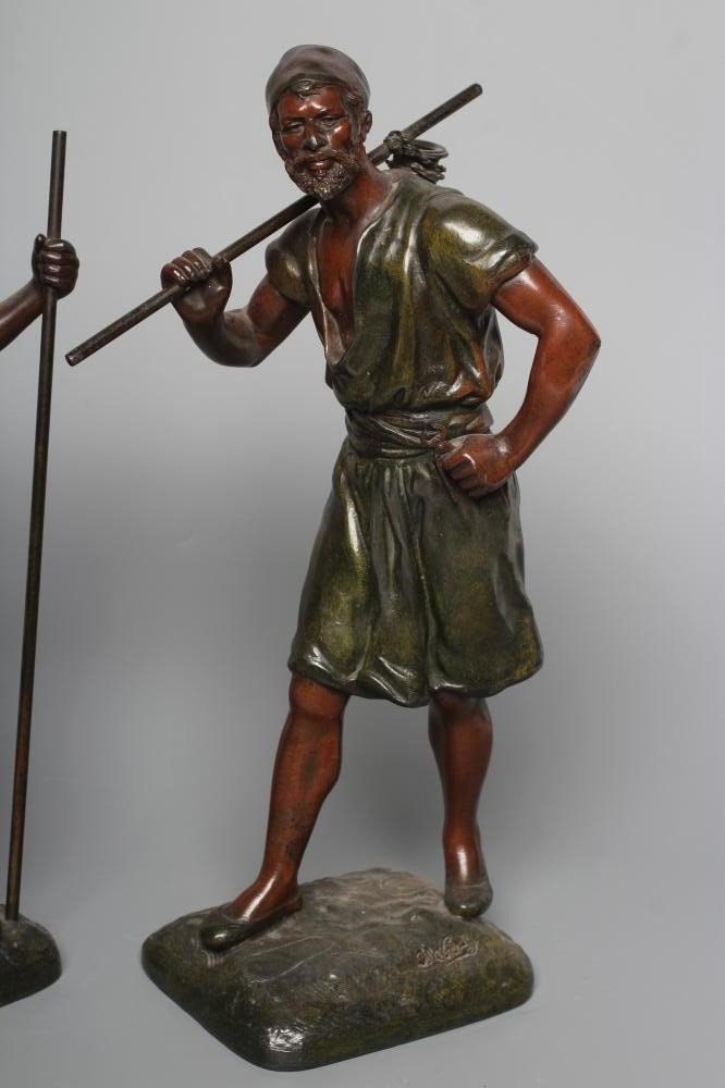 A PAIR OF PAINTED SPELTER ARAB MALE WATER CARRIERS, after Marcel Debut (1865-1933) each modelled Image