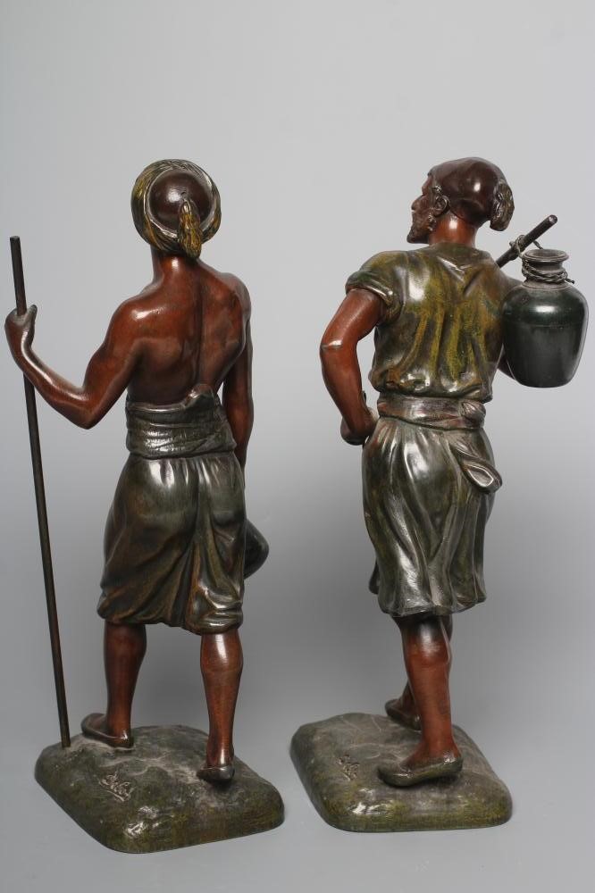 A PAIR OF PAINTED SPELTER ARAB MALE WATER CARRIERS, after Marcel Debut (1865-1933) each modelled Image