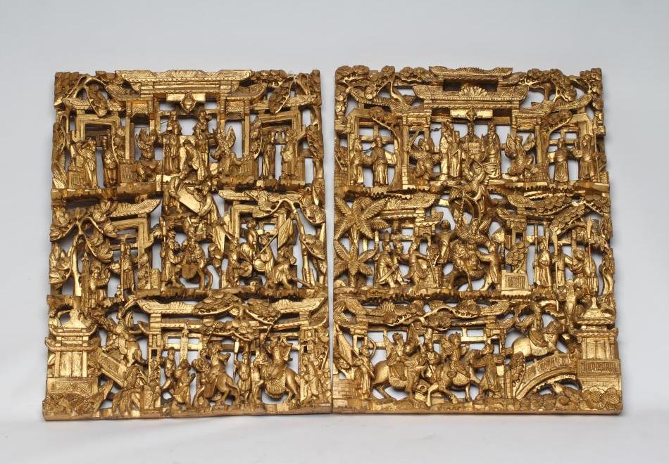A PAIR OF CHINESE CARVED AND PIERCED GILTWOOD PANELS, c.1900, of oblong form with figures in a Image