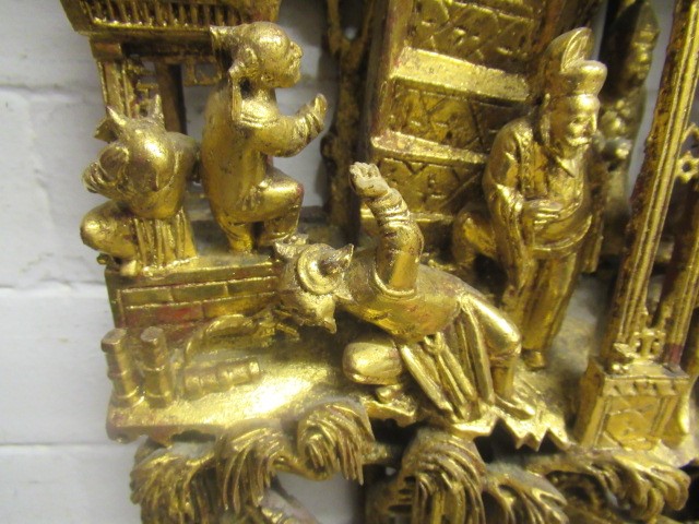 A CHINESE CARVED AND PIERCED GILTWOOD PANEL Image