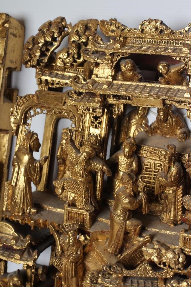 A CHINESE CARVED AND PIERCED GILTWOOD PANEL Image